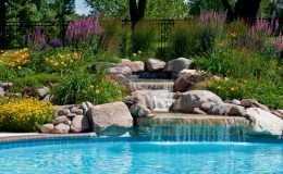 Beautifully landscaped backyard pool with a waterfall, Waterfall, Rock Waterfall